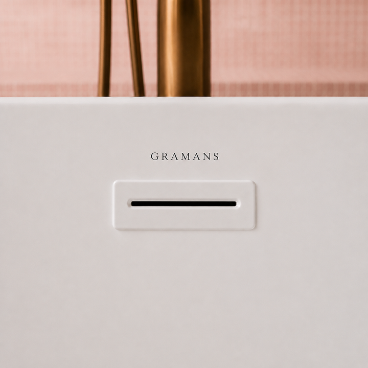 Bloemendaal freestanding bathtub, close-up of white overflow with Gramans mark, Gramans Bathware