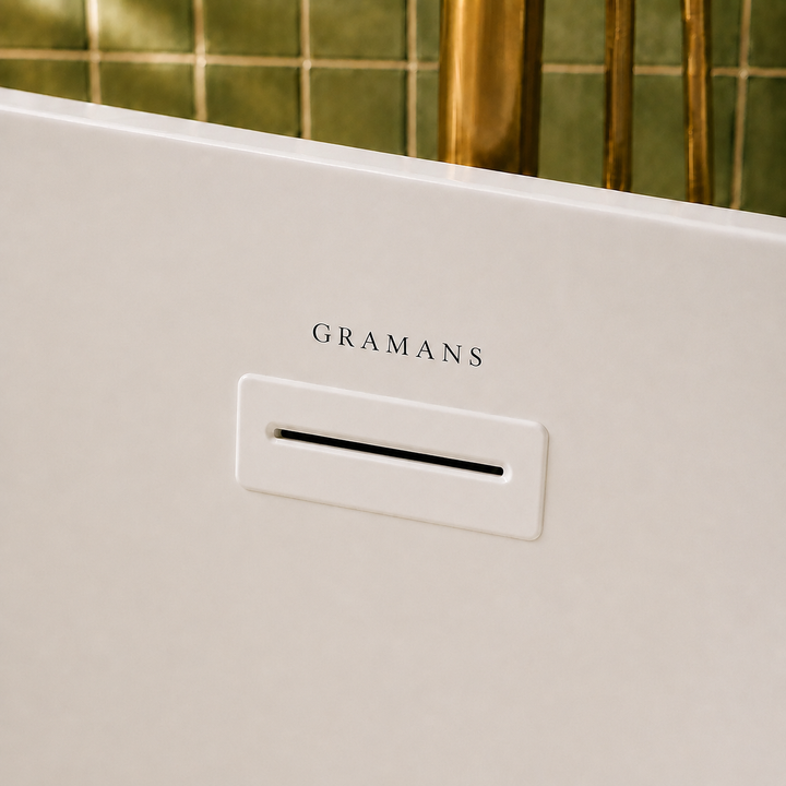 Naarden 67 inch freestanding bathtub, close-up of white overflow with Gramans mark, Gramans Bathware